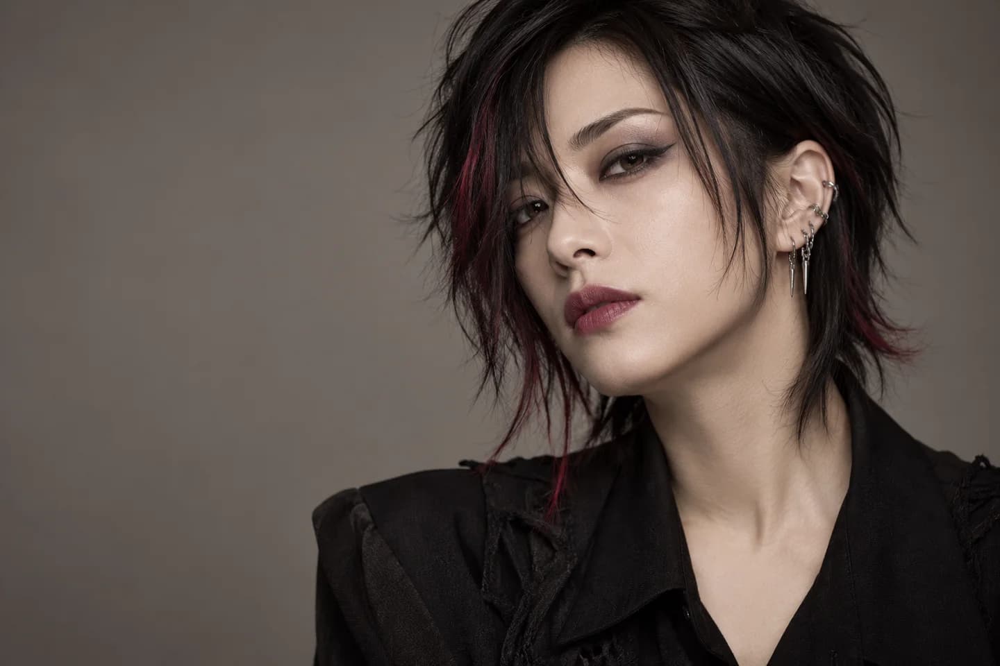 Visual kei makeup inspiration with charcoal eye shadow, graphic eyeliner and black hair with wine-red accents Visual kei makeup inspiration with charcoal eye shadow, graphic eyeliner and black hair with wine-red accents