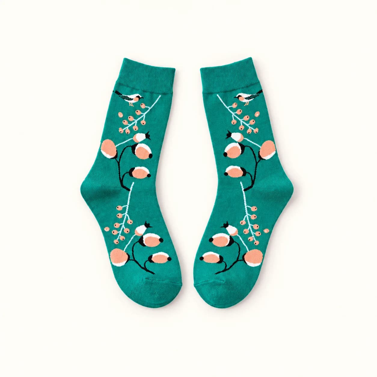 Pair of teal Green Nature Socks with peach, white and black bird and branch motifs Pair of teal Green Nature Socks with peach, white and black bird and branch motifs