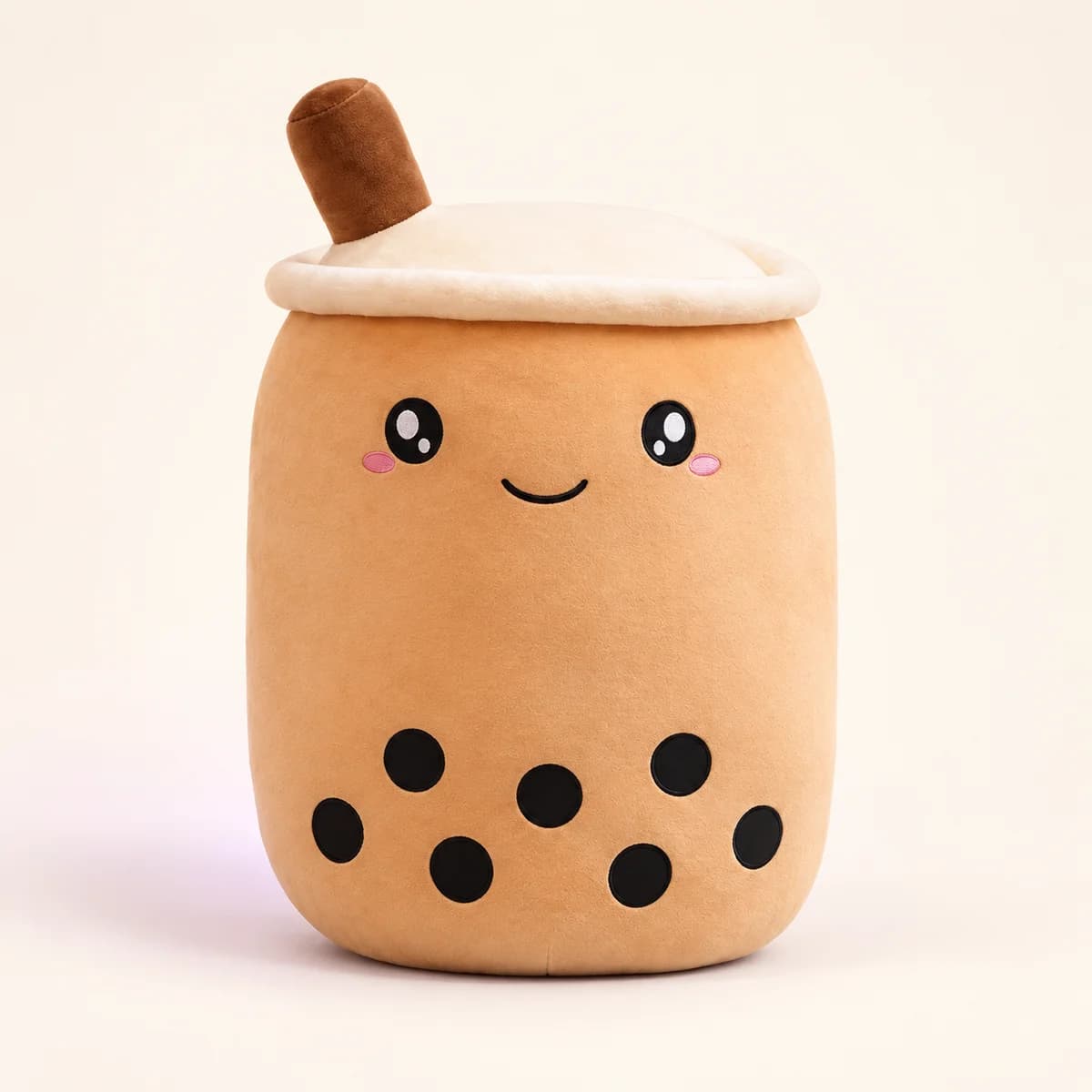 Caramel bubble tea plush with a cream lid, brown straw, smiling face and black boba dots Caramel bubble tea plush with a cream lid, brown straw, smiling face and black boba dots