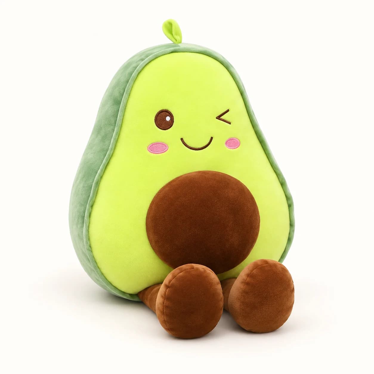 Green Wink Avocado Plush with a brown pit, pink cheeks and dangling brown legs Green Wink Avocado Plush with a brown pit, pink cheeks and dangling brown legs
